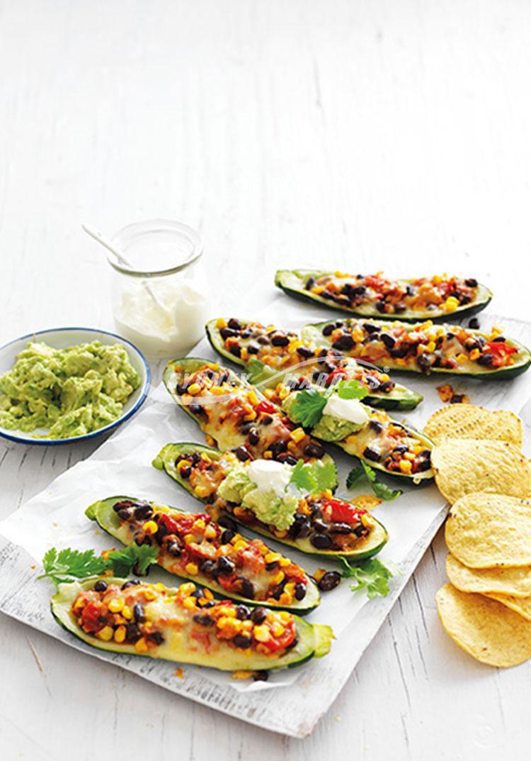 Mexican-style stuffed zucchinis with avocado mash