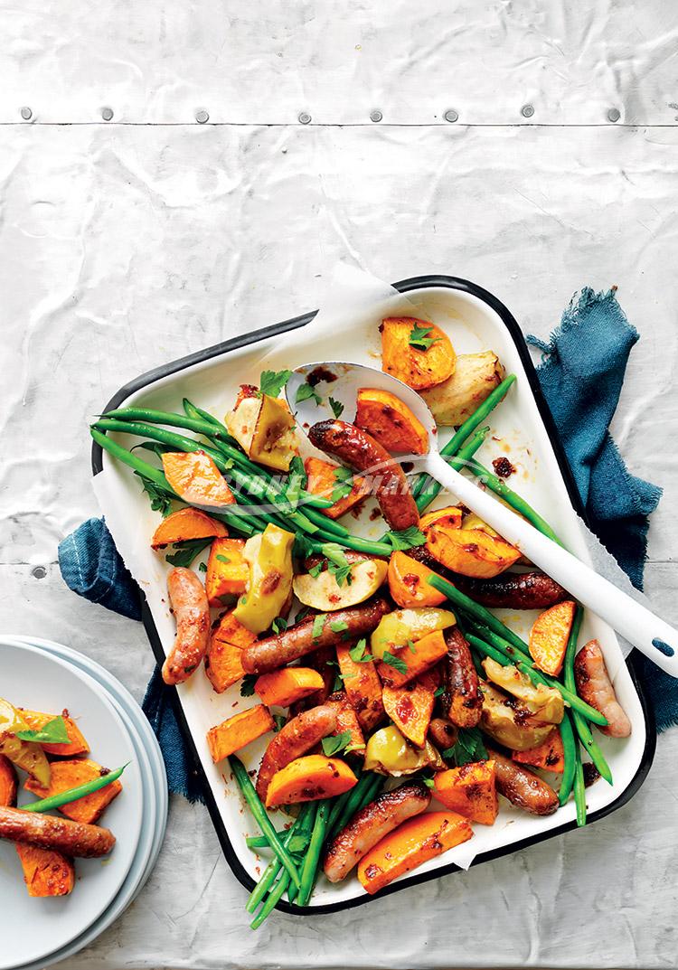 Roasted kumara, apple & chipolata tray bake